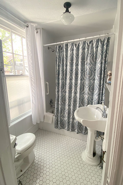 white tiled bathroom